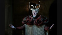 a man in a costume with horns on his head