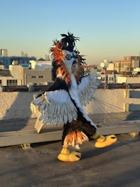 an eagle mascot on a roof